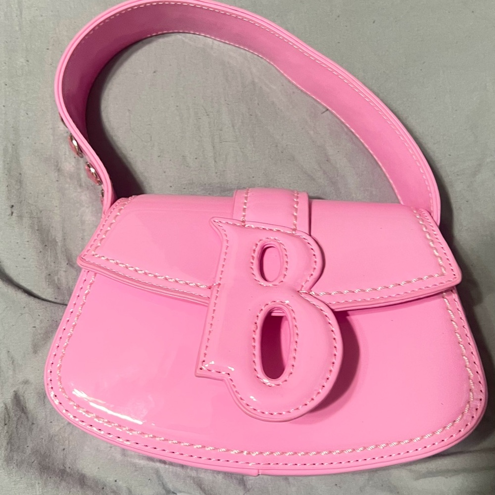 Brand new Bratz clutch from Dollskill. Pink gems on the strap. Never used.
